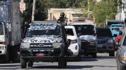 Soldiers from the Haitian Armed Forces patrol as authorities reinforced the security days after six ... Soldiers from the Haitian Armed Forces patrol as authorities reinforced the security days after six ...