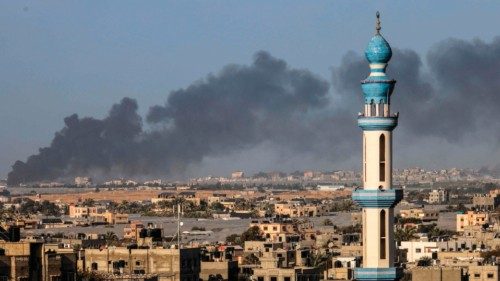 A picture taken from Rafah shows smoke billowing over Khan Yunis in the southern Gaza Strip during ... A picture taken from Rafah shows smoke billowing over Khan Yunis in the southern Gaza Strip during ...