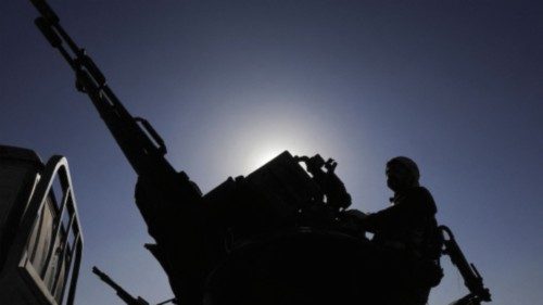 An armed Houthi follower mans a machine gun on a pick-up truck during a protest to decry the ... An armed Houthi follower mans a machine gun on a pick-up truck during a protest to decry the ...