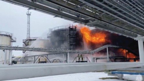 FILE PHOTO: Firefighters extinguish oil tanks at a storage facility that local authorities say ... FILE PHOTO: Firefighters extinguish oil tanks at a storage facility that local authorities say ...
