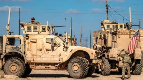 US soldiers patrol an area with armoured personnel carriers (APC) in the town of Tal Hamis, ... US soldiers patrol an area with armoured personnel carriers (APC) in the town of Tal Hamis, ...