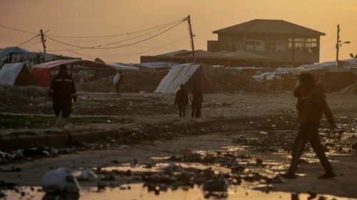 epa11114528 Displaced Palestinians who fled their houses from the northern Gaza Strip walk past a ... epa11114528 Displaced Palestinians who fled their houses from the northern Gaza Strip walk past a ...
