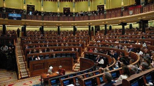 Members of parliament attend a plenary session before a vote on the government's controversial ... Members of parliament attend a plenary session before a vote on the government's controversial ...