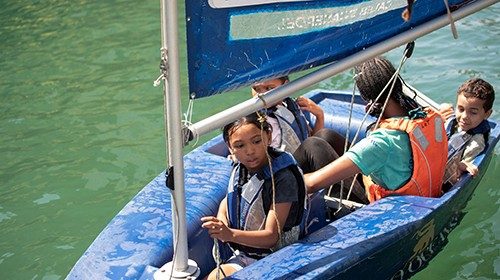 Children from the Manenberg community sail optimists through a channel by the Victoria and Albert ... Children from the Manenberg community sail optimists through a channel by the Victoria and Albert ...