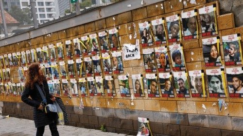 Ana Chadicov, from Uruguay, looks at pictures of hostages kidnapped in the deadly October 7 attack ...