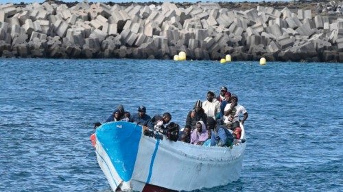 TOPSHOT - Migrants sit in a boat, after the Spanish Salvamento Maritimo (Sea Search and Rescue ... TOPSHOT - Migrants sit in a boat, after the Spanish Salvamento Maritimo (Sea Search and Rescue ...