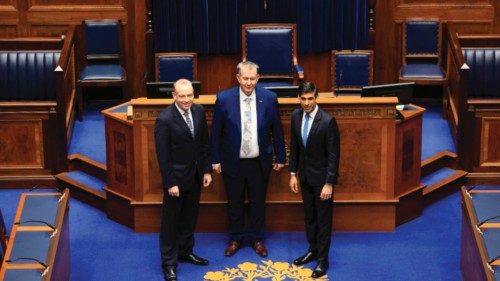 Britain's Prime Minister Rishi Sunak (R) tours the Assembly Chamber with Northern Ireland Assembly ...