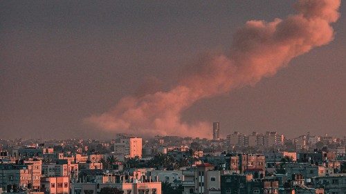 TOPSHOT - A picture taken from Rafah in the southern Gaza Strip shows smoke rising over buildings in ...