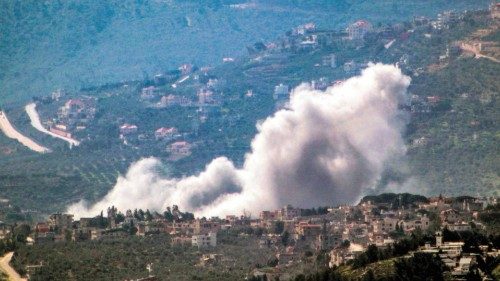 Smoke billows during Israeli bombardment on the village of Kfarkila in southern Lebanon near the ...
