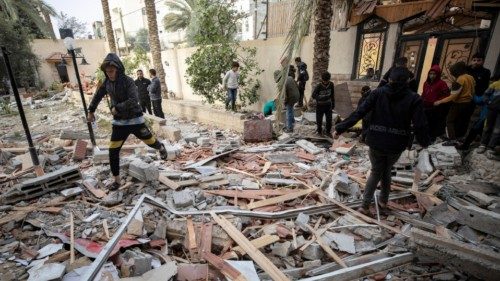 epa11141318 Palestinians from the Ghannam family search for missing people under the rubble after an ... epa11141318 Palestinians from the Ghannam family search for missing people under the rubble after an ...