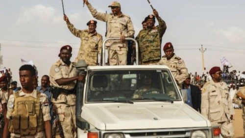 File - Gen. Mohammed Hamdan Dagalo, the deputy head of the military council, waves to a crowd during ...