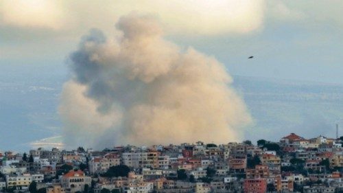 Smoke billows from the site of an Israeli air strike on the southern Lebanese village of Khiam near ...