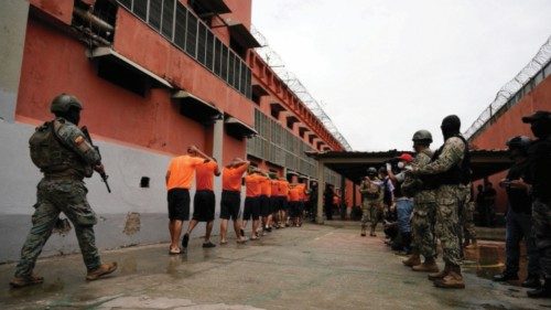 Soldiers escort inmates at cell block 3 of the militarised Litoral prison, as the measures taken by ...