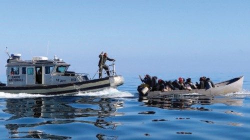 FILE PHOTO: Tunisian coast guards try to stop migrants at sea during their attempt to cross to ...