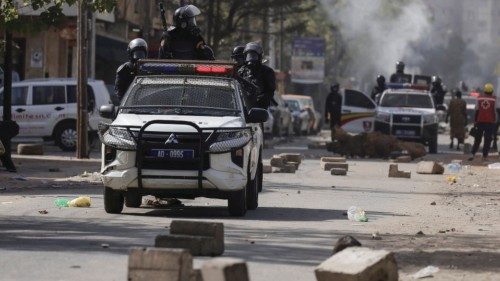 FILE PHOTO: Riot police members sit on a pick up during a protest against the postponement of the ... FILE PHOTO: Riot police members sit on a pick up during a protest against the postponement of the ...