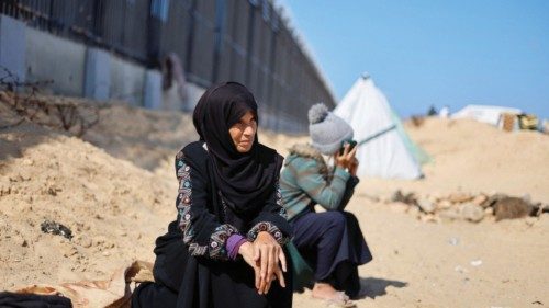 Displaced Palestinian woman Laila Abu Mustafa, who fled her house due to Israeli strikes, shelters ... Displaced Palestinian woman Laila Abu Mustafa, who fled her house due to Israeli strikes, shelters ...
