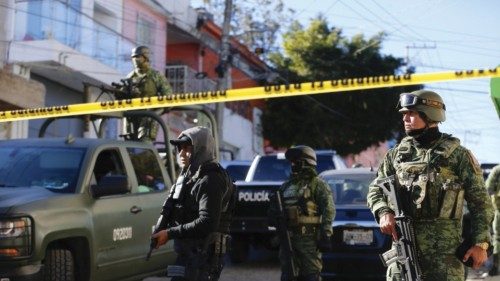 epaselect epa11165123 Members of the Mexican Army guard the area where an armed attack took place ... epaselect epa11165123 Members of the Mexican Army guard the area where an armed attack took place ...