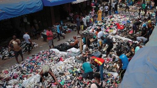 Traders spread out secondhand clothes for sale at the Kantamanto market in Accra, Ghana, on November ...