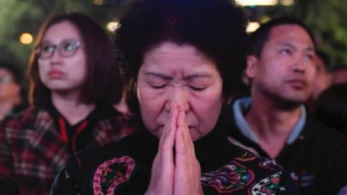 Chinese Catholics attend a mass on Holy Saturday, part of Easter celebrations at Beijing's ...