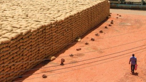 TOPSHOT - A man walks past sacks of grains at a market in Gedaref, eastern Sudan, on February 22, ... TOPSHOT - A man walks past sacks of grains at a market in Gedaref, eastern Sudan, on February 22, ...