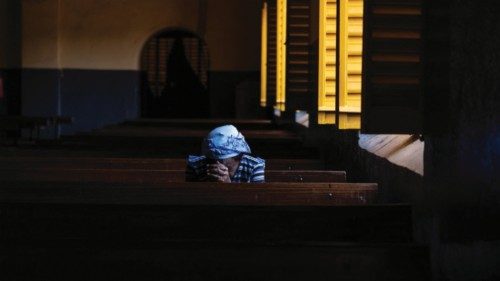 A worshipper prays at Ouagadougou?s cathedral on June 12, 2022. (Photo by OLYMPIA DE MAISMONT / AFP) ... A worshipper prays at Ouagadougou?s cathedral on June 12, 2022. (Photo by OLYMPIA DE MAISMONT / AFP) ...
