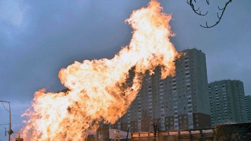 (FILES) Fire and burnt-out cars are seen after a missile strike in Kyiv on January 2,2024, amid the ... (FILES) Fire and burnt-out cars are seen after a missile strike in Kyiv on January 2,2024, amid the ...