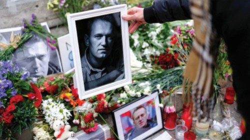 A woman places a portrait of late Russian opposition leader Alexei Navalny, who died unexpectedly in ... A woman places a portrait of late Russian opposition leader Alexei Navalny, who died unexpectedly in ...