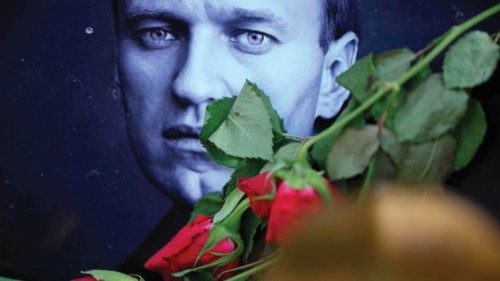 Roses are laid at a picture of late Russian opposition leader Alexei Navalny at a makeshift memorial ... Roses are laid at a picture of late Russian opposition leader Alexei Navalny at a makeshift memorial ...