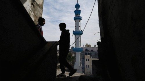 Children stand as Palestinians gather for Friday prayers near the ruins of a mosque destroyed in ... Children stand as Palestinians gather for Friday prayers near the ruins of a mosque destroyed in ...