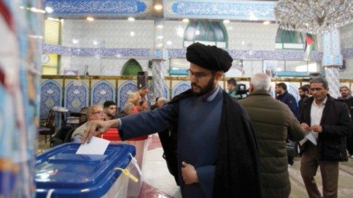 epa11190396 An Iranian cleric casts his vote during the Iranian legislative election at a mosque in ... epa11190396 An Iranian cleric casts his vote during the Iranian legislative election at a mosque in ...