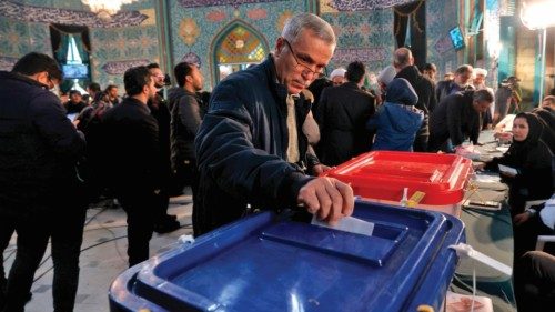 An Iranian man casts his ballot at a polling station in Tehran, during elections to select members ... An Iranian man casts his ballot at a polling station in Tehran, during elections to select members ...