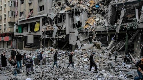 Palestinians walk amid the rubble of houses destroyed by Israeli bombardment in Gaza City on March ... Palestinians walk amid the rubble of houses destroyed by Israeli bombardment in Gaza City on March ...
