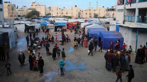 Displaced Palestinians walk around in an UNRWA school housing displaced Palestinians, in Rafah in ... Displaced Palestinians walk around in an UNRWA school housing displaced Palestinians, in Rafah in ...