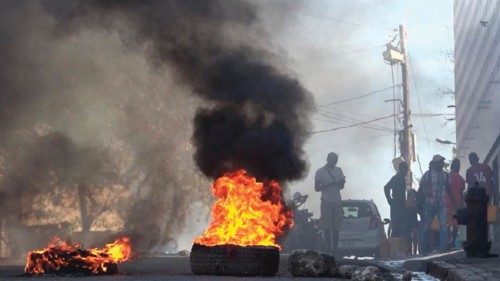 This screen grab taken from AFPTV shows tires on fire near the main prison of Port-au-Prince, Haiti, ...