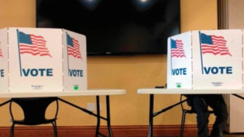 A lone voter casts his ballot at the South Branch Library during the presidential primary in ... A lone voter casts his ballot at the South Branch Library during the presidential primary in ...