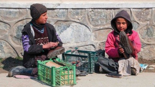 Child cobblers polish shoes along a street in Fayzabad on March 4, 2024. (Photo by OMER ABRAR / AFP) ... Child cobblers polish shoes along a street in Fayzabad on March 4, 2024. (Photo by OMER ABRAR / AFP) ...