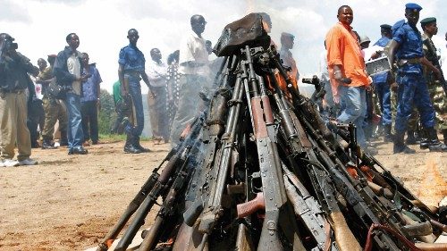 Weapons being burnt during the official launch of the Disarmament, Demobilization, Rehabilitation ...