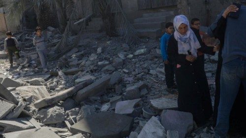 epa11199919 Palestinians walk past the rubble of a destroyed house following Israeli airstrikes in ... epa11199919 Palestinians walk past the rubble of a destroyed house following Israeli airstrikes in ...