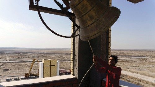 A worker tests the bell at the 'Ibrahim Al-Khalil' church, which was built in an effort to attract ... A worker tests the bell at the 'Ibrahim Al-Khalil' church, which was built in an effort to attract ...
