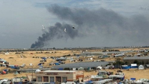 Smoke rises during an Israeli ground operation in Khan Younis, amid the ongoing conflict between ...