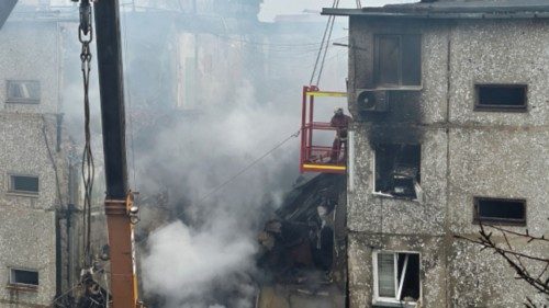 A rescuer works at a site of an apartment building heavily damaged by a Russian drone strike, amid ... A rescuer works at a site of an apartment building heavily damaged by a Russian drone strike, amid ...