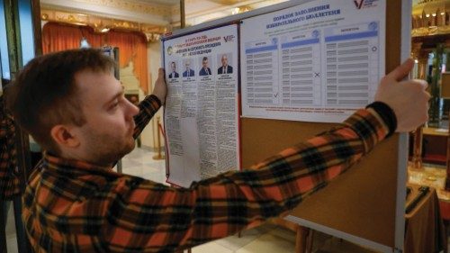 A member of a local electoral commission works at a polling station during preparations for the ... A member of a local electoral commission works at a polling station during preparations for the ...