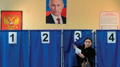 A woman votes in Russia's presidential election at a polling station in Donetsk, Russian-controlled ... A woman votes in Russia's presidential election at a polling station in Donetsk, Russian-controlled ...