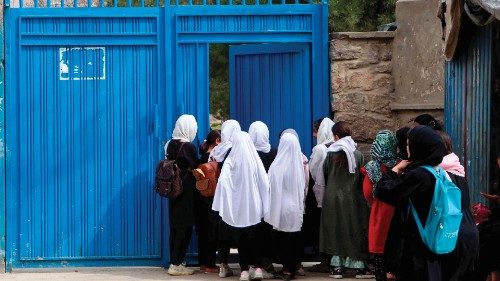 Afghan primary school girls arrive for their first class following the start of the new academic ...