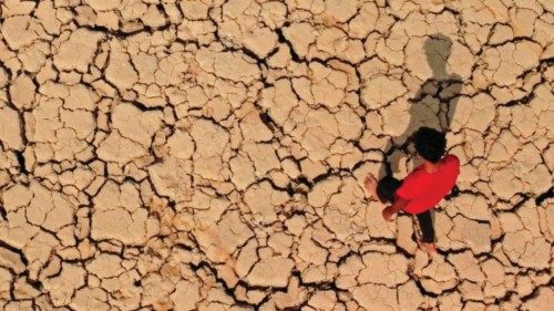 (FILES) A youth walks on cracked and dried up soil at the Hawizeh marshes, which straddle Iraq's ... (FILES) A youth walks on cracked and dried up soil at the Hawizeh marshes, which straddle Iraq's ...