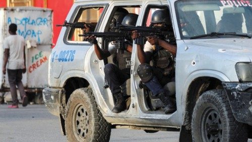 Police officers take part in a confrontation with gangs near the National Palace, in Port-au-Prince, ... Police officers take part in a confrontation with gangs near the National Palace, in Port-au-Prince, ...