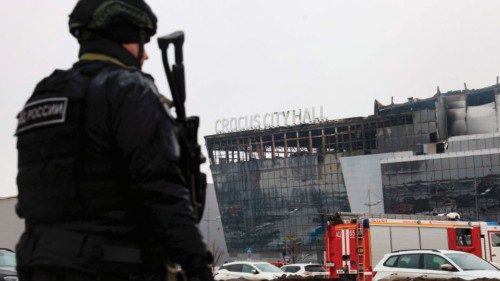 TOPSHOT - A law enforcement officer patrols the scene of the gun attack at the Crocus City Hall ... TOPSHOT - A law enforcement officer patrols the scene of the gun attack at the Crocus City Hall ...