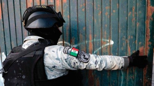 A member of the National Guard guards the area where a group of searching mothers from the ... A member of the National Guard guards the area where a group of searching mothers from the ...