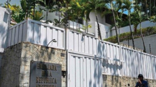 A motorcyclist rides past the residence of Argentina's ambassador in Caracas on March 27, 2024. The ...