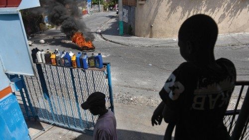 epa11232417 A burning tire next to a debris barricade on a street where lifeless bodies were found ... epa11232417 A burning tire next to a debris barricade on a street where lifeless bodies were found ...